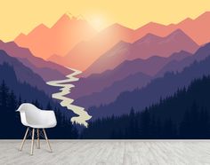 a chair sitting on top of a wooden floor in front of a mountain wall mural