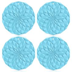 four pieces of blue origami paper on a white background, each with a circular design