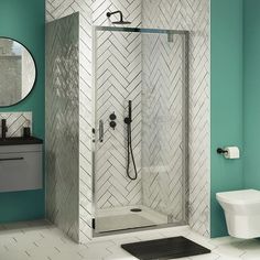 a bathroom with a shower, toilet and sink in it's corner stall area