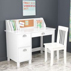 a white desk and chair in a room