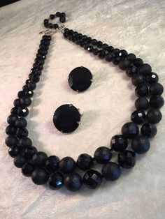 "This is a traditional and very collectible Hobé set that is just so beautiful - the necklace is features very heavy black glass beads: the smaller faceted beads shine brightly and in contrast the larger faceted beads have more of a matt finish. There are tiny glass spacers between all beads. It must be held and seen in person! The chain strung double-strand necklace measures 21-1/2\" (open at shortest strand) and has a hook clasp - the silver end bars are both marked Hobé. There is also a beade Classic Onyx Jewelry For Party, Classic Black Beaded Jewelry As Gift, Costume Jewelry With Faceted Beads For Evening, Evening Costume Jewelry With Faceted Beads, Costume Jewelry With Black Round Beads, Evening Jewelry With Faceted Round Beads, Ava Gardner, Floral Pins, Bette Davis