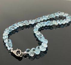 Natural Blue Topaz AA+ Quality Beaded Necklace with Genuine Pave Diamonds in the Clasp. SOLD AS = 17.25” NECKLACE ( Including Clasp) CUT STONE SIZE = 7.5mm - 8mm STONE = NATURAL SKY BLUE TOPAZ GRADE = AA+ GRADE CLASP = GENUINE PAVE DIAMOND LOBSTER CLASP ( Grayish Black Rhodium ) CLASP SIZE = 17.5mm x 11mm METAL = .925 STERLING SILVER ( Black Rhuthenium over Sterling Silver) DIAMOND : CONFLICT FREE GENUINE DIAMONDS This Necklace is Handmade by using Faceted Natural Sky Blue Topaz Cut Stones which Luxury Blue Faceted Bead Necklace, Blue Topaz Necklace, Topaz Necklace, Sky Blue Topaz, Black Rhodium, Silver Diamonds, Pave Diamonds, Gift Necklace, Blue Topaz