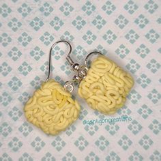 Ramen Earrings Noodles measure approximately between 1.5cm to 2.25cm Materials: ▫ Polymer Clay ▫ Hypoallergenic Hanging Earring Hook Each Ramen square is handmade by me, so you may receive a pair of earrings that are slightly different from the ones pictured in the listing. As they are all made by hand all are similar but no two pairs will ever be the same! I can also do custom orders. Please feel free to send me a message with any questions or ideas! Thanks for checking out my shop! Gift Earrings With Square Pendant For Pierced Ears, Gift Square Pendant Earrings For Pierced Ears, Handmade Yellow Rectangular Earrings, Yellow Rectangular Earrings As A Gift, Yellow Rectangular Earrings For Gifts, Yellow Rectangular Earrings Gift, Square Pendant Earrings For Gift, Rectangular Yellow Earrings For Gift, Handmade Square Earrings For Gift