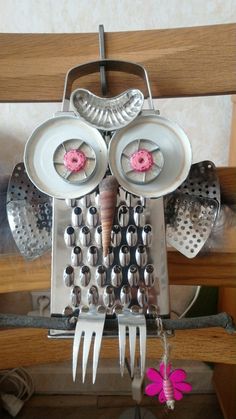 an owl made out of forks and spoons