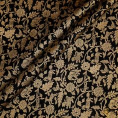 "\nZari vines, animal motifs\u00a0and intricate jungle scenes make this a piece of woven art. Our shikargah thaan is an ode to handloom and a true Banarasi masterpiece.\n\u00a0\n\n\nColor\u00a0-\u00a0A\u00a0stunning shade of\u00a0Black\n\nTechnique\u00a0- The finest Banarasi weaving technique passed down through generations of weavers.\u00a0\u00a0\n\nFabric\u00a0-\u00a0Soft as butter, pure\u00a0Satin Silk\n\n\nSpecifications\u00a0-\u00a0A luxurious and intricate shikargah zari jaal!\u00a0\u00a0\n\n\nTilfi Promise\u00a0- Pure. Handloom. Banaras.\nNote - 1 item equals 1 metre.\n\n\u00a0\nSince\u00a0this product is handwoven, there might be slight irregularities. But don't you think these add to the singular charm of a handloom beauty?" Jungle Scene, Handloom Fabric, Woven Art, Black Pure, Animal Motifs, Weaving Art, Satin Silk, Weaving Techniques, Shades Of Black