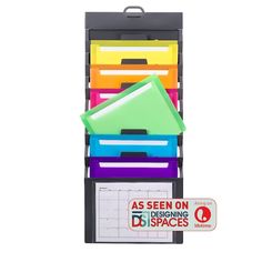 assorted file folders stacked on top of each other in a black box with red sticker