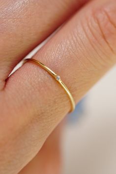 Discover the pinnacle of Korean craftsmanship with our 14K Solid Gold CZ Simple Stone Ring. Handmade, dainty, and stackable, this ring elevates your style with a touch of elegance. Perfect for every occasion. Shop now for sustainable luxury. Simple Stone Ring, Gold Rings Stackable, Hypoallergenic Jewelry, Comfort Design, Stackable Ring, Stackable Rings, Ring Handmade, Stone Ring, Jewelry Earrings Studs