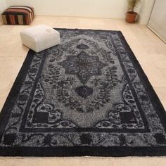 a black and white rug on the floor in a room