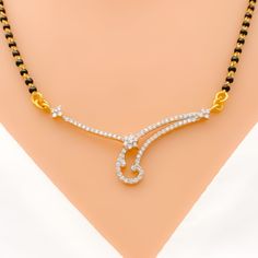 Elevate your look with our Dainty Curved Diamond Mangal Sutra. Crafted in 18k yellow gold with a 0.54ct round brilliant cut diamond pendant, this piece exudes elegance and sophistication. The black bead chain is made of 22k gold and measures 18 inches in length with a drop length of 0.5 inches. With an item weight of 2.5 grams, this piece is perfect for everyday wear. PRODUCT DETAILS Diamond Pendant Gold Purity(karat): 18k Item Weight(grams): 2.5 Item Finish: Yellow Gold Stone: Diamond Diamond W Mangal Sutra, Bride Jewelry Set, Bride Jewelry, Lock Style, Vs Diamond, Bead Chain, Gold Stone, Pendant Gold, Bride Jewellery