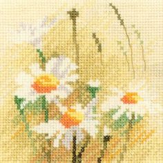 a cross stitch picture of daisies in a vase