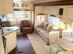 a living room and dining area in an rv