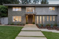 Beverly Hills ranch home stacked slate stone wall exterior with ribbon windows & California landscape design. Stone Wall Exterior, Slate Stone Wall, California Landscape Design, Timber Beams