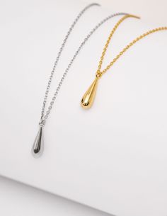 "INDRA" our minimalist water drop, teardrop gold pendant necklace. These lightweight gold necklace feature a simple style pendant with an abstract single water/teardrop droplet. These are made with 925 sterling silver throughout, coated with a layer of 18k gold or rhodium (silver colour), so easy to wear for an effortless everyday look! The necklace chain measures approximately 45.5CM in total (40.5 + 5CM extension). AS PICTURED: Taylor is stacking our INDRA teardrop necklace with our DAMLA drop Modern Teardrop Pendant Drop As Gift, Modern Tarnish-resistant Drop Gift, Modern Dangle Drop Necklace As Gift, Modern Dangle Drop Necklace For Gifts, Minimalist Long Drop Hypoallergenic Earrings, Minimalist Hypoallergenic Long Drop Earrings, Hypoallergenic Teardrop Pendant For Everyday Wear, Everyday Hypoallergenic Teardrop Pendant, Minimalist Teardrop Pendant Drop Earrings For Everyday