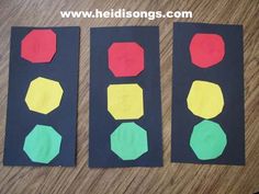 three pieces of paper cut out to look like traffic lights