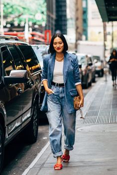 How to Wear a Jean Jacket Style a tailored denim blazer with cuffed jeans and bright red mules. Denim Blazer Street Style, What To Wear For Fashion Week, Elevated Jeans And Tee, Cool Denim Outfits, Denim On Denim Outfit Spring, Tailored Denim Jacket, Denim And Blazer Outfit, Denim Jean Outfits, Denim Jacket And Jeans Outfit