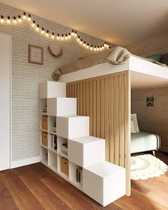 there is a loft bed in the room with stairs leading up to it and bookshelves below