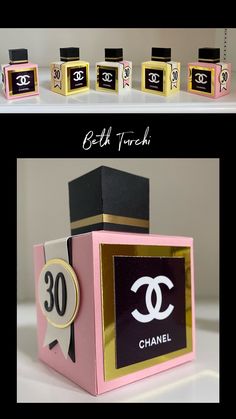 three different boxes with chanel logos on them, one is pink and the other is gold