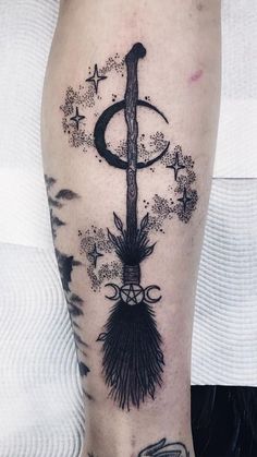 a black and white tattoo on the leg of a person