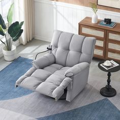 a reclining chair sitting on top of a blue rug