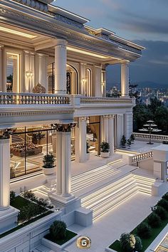 a large white building with columns and lights