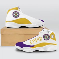 a pair of white and yellow sneakers with the seal of approval on them in front of a cardboard box