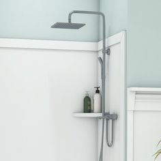 a bathroom with a shower head and shelves on the wall