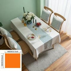 a dining room table with place settings on it