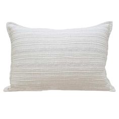 a white pillow that is on a white background with no one in the photo to describe it