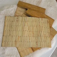 four pieces of bamboo laid out on a bed