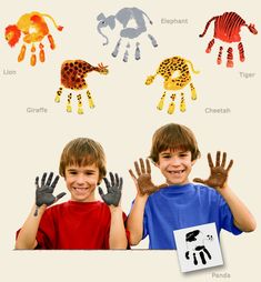 two young boys with their hands up in front of an image of handprints