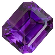 PRODUCT INFORMATION: Faceted Purple Amethyst Weight: 15.60 Carats Dimension: 16x13.6x10.6 Mm Shape: Emerald Origin: Brazil Color: Deep Purple Treatment: None DESCRIPTION: This stunning 15.60 carats faceted purple amethyst is a perfect centerpiece for a necklace, exuding elegance and sophistication. Cut into an exquisite emerald shape, the gemstone showcases sharp facets that enhance its deep, royal purple hue, allowing the stone to reflect light beautifully from every angle. Sourced from Brazil, Brazil Colors, Royal Purple, Purple Hues, Fine Jewelry Collection, Vintage Inspired Design, Art Furniture, Amethyst Gemstone, Purple Amethyst, Deep Purple