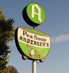 a sign that says pea soup and an advertiser's logo on it