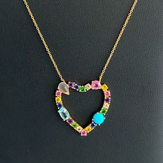 14kt Gold Diamond & Multi-Gemstone Open Heart Necklace Beautiful Multi-Shaped Gemstones Including Diamonds, Sapphires, Rubies, Emeralds, Moonstone, Aquamarine, And Turquoise Are Prong Set In 14kt Gold. On An Adjustable 15-17 Inch 14kt Gold Chain With Lobster Clasp Stamped 14kt - Heart Is 1 X 1 Inches 14k Gold Heart Necklace With Gemstone, Elegant Multicolor Heart Cut Jewelry, Fine Jewelry Diamond Heart Necklace With Gemstone, Elegant Multi-stone Heart Cut Jewelry, Multicolor Heart Cut Multi-stone Jewelry, Yellow Gold Gemstone Heart Necklace For Anniversary, Fine Jewelry Multi-stone For Valentine's Day, 14k Gold Heart Cut Gemstone Necklace, Yellow Gold Heart Necklace With Gemstone