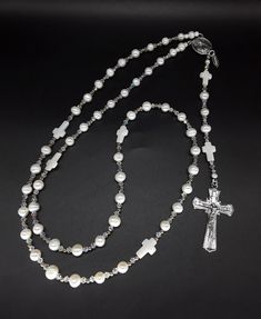 The Pearl Moonstone 5 Decade Catholic Rosary (large) is an exclusive, special and very powerful Rosary. It has been created for individuals that seek to purify all darkness during their life and to attain holiness. In regards to the beads. The beads are triple-A high quality Moonstone beads combined with White Pearls (all beads, and pearls, are completely cleansed and purified). Second, its cross: made of a pure 925 silver cross symbolizing balance and stability. Third, the Rosary has been offic Catholic Rosary, Rosary Catholic, Swarovski Crystal Beads, Moonstone Beads, The Pearl, Ancient Greece, Silver Cross, Rosary, Pearl White