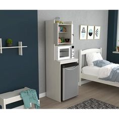 a bedroom with a microwave and bed in it