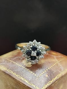 This beautiful vintage ring is hallmarked London 1986 featuring Sparkling sapphire and cubic zirconia gemstones set in a cluster with 9ct yellow gold band.  UK size - R1/2 US size - 8.75 Message me any questions Beautiful Rings Vintage, Etsy Gold Ring, Vintage London, Yellow Gold Ring, Vintage Ring, Design Floral, Gold Band, Yellow Gold Rings, Rings Statement