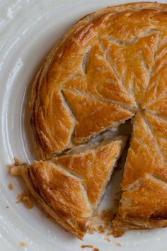 a piece of pie sitting on top of a white plate