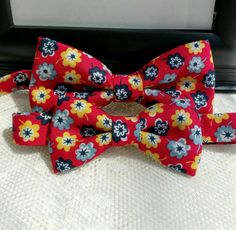 "Floral Matching Bow Tie Set is a Custom Bow Tie and Fully lined handmade. The Bow Ties are great gifts and make for beautiful holiday pictures and outfits. This Bow Ties are perfect for your little one to wear and match his daddy on that special event or for that special family picture. Please Note: The price is $28.99 for the set of Bow Ties. Please select sizes when ordering. Bow Ties are made out of 100% Cotton Fabric Fully lined and they measure approximately: Men's 5\" by 21/2\" Tall and a Adjustable Bow Tie Back Bow As Gift, Red Tie As A Summer Gift, Adjustable Red Bow With Ties, Red Bow Tie With Butterfly Knot For Gift, Red Bow Tie As A Gift, Red Bow Tie As Gift, Adjustable Bow Tie For Gifts, Adjustable Bow Tie For Suit As Gift, Adjustable Red Bow For Gifts