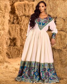 This elegant Habesha dress features a rich, dark blue hue with beautifully crafted patterns that capture the essence of tradition and modern style. The intricate detailing adds sophistication, making it perfect for special occasions or cultural celebrations. Material Cotton Menen Thread Estimated delivery : 4 weeks to 6 weeks Contact WhatsApp +1(304)-306-2784Email: contact@ethiopian.store Ethiopian Traditional Dress Modern, Holiday Wedding Dress, Habesha Women, Ethiopian Clothing, Habesha Dress, Ethiopian Traditional Dress, Ethiopian Dress, Habesha Kemis, Cultural Celebration