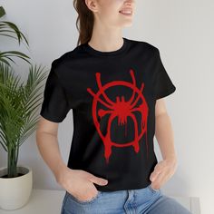 Inspired by Miles morales Spiderman, across the multiverse, thus  classic unisex jersey short sleeve tee fits like a well-loved favorite. Soft cotton and quality print make users fall in love with it over and over again. These t-shirts have-ribbed knit collars to bolster shaping. The shoulders have taping for better fit over time. Dual side seams hold the garment's shape for longer.  .: 100% Airlume combed and ringspun cotton (fiber content may vary for different colors) .: Light fabric (4.2 oz/yd² (142 g/m .: Retail fit .: Tear away label .: Runs true to size Miles Morales Mom, Miles Morales Clothes Aesthetic, Fandom Crew Neck Top With Logo Print, Miles Morales Clothing Style, Miles Morales Sweater, Fandom T-shirt With Logo Print, Fandom T-shirt With Sublimation Print And Crew Neck, Fandom T-shirt With Logo Print And Crew Neck, Fandom Crew Neck T-shirt With Sublimation Print