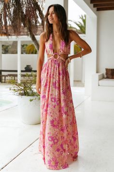 You will be feeling like the main character in the Make It Mine Maxi Dress. Stand out from the crowd and style yours with neutral block heels and gold adornments for your next day out in the sun. Floaty maxi dress. true to size Plunge neckline with halter tie O-ring detail to centre Floral print throughout Waist tie details Elasticised waist Split to left side Style slips on Not lined Light weight. textured rayon Non stretchy material Cold hand wash only Model wears XS Chic V-neck Maxi Dress For Summer Parties, Vacation Backless Maxi Dress, Beach Sundress With Cutouts, Fitted Maxi Dress With Cutout For Beach, Chic Backless Maxi Dress For Vacation, Beach Season Vacation Dresses With Cutout Details, Fitted Cutout Maxi Dress For Beach, Cutout Dress For Vacation, Beach Season, Cutout Dresses For Beach Season Vacation