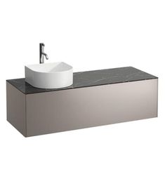 a white sink sitting on top of a counter next to a faucet mounted above it