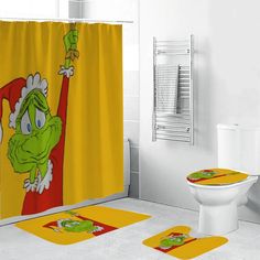 a bathroom scene with focus on the grin face shower curtain and toilet seat cover set