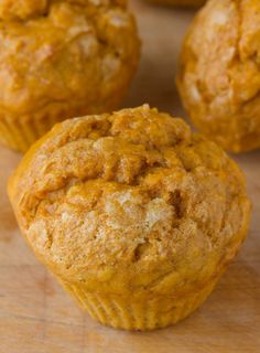 several muffins sitting on top of a wooden table