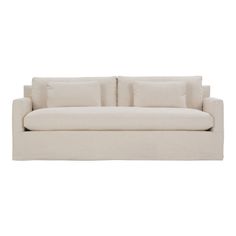 a white couch with pillows on it