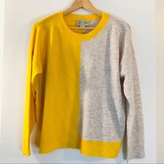 Cozy Up For A Movie Night With This Absolutely Adorable Knit Half Yellow, Half Neutral Oatmeal Pullover Sweater By Anthropologie’s Saturday Sunday. There Are Spots Of Darker Thread Throughout. 70% Polyester, 27% Nylon, 3% Spandex Hand Wash Long Sleeves Boxy Oversized Slouchy Color Block Vertical Stripes Crew Neck Knit Pullover Not Exact, Flat: B 24.5” Standard: 23.5" - 24”L Oatmeal Ecru Tan Beige Sand Yellow Mustard Dijon Pineapple Ribbed Hem Lowest Price Listed Final Sale Offers Ignored Ty Yellow Long Sleeve Top With Contrast Color, Yellow Patchwork Sweater For Winter, Yellow Patchwork Winter Sweater, Yellow Color Block Sweater For Winter, Yellow Color Block Tops For Fall, Yellow Long Sleeve Sweater For Layering Outfits, Yellow Sweater For Spring Layering, Yellow Color Block Knit Sweater, Yellow Knit Sweater