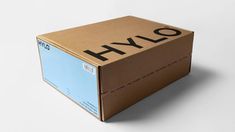 a cardboard box with the word hylo printed on it is shown in front of a white background