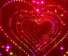 a red heart surrounded by many colorful lights