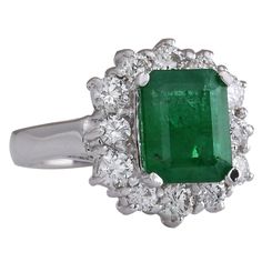 Stamped: 14K White GoldTotal Ring Weight: 6.6 GramsRing Length: N/ARing Width: N/AGemstone Weight: Total Natural Emerald Weight is 2.44 Carat (Measures: 9.56x7.62 mm)Color: GreenDiamond Weight: Total Natural Diamond Weight is 1.05 CaratColor: F-G, Clarity: VS2-SI1Face Measures: 15.88x14.76 mmSku: [702838W] Gia Certified Cluster Platinum Ring, Gia Certified Luxury Cluster Rings, Luxury Gia Certified Cluster Rings, Classic Platinum Gemstones With Halo Setting, Classic Green Cluster Ring In Platinum, Classic Green Platinum Cluster Ring, Gia Certified White Gold Emerald Cluster Ring, Luxury Cluster Emerald Ring With Prong Setting, Formal Gia Certified Emerald Gemstones