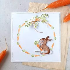 a card with carrots and a bunny on it